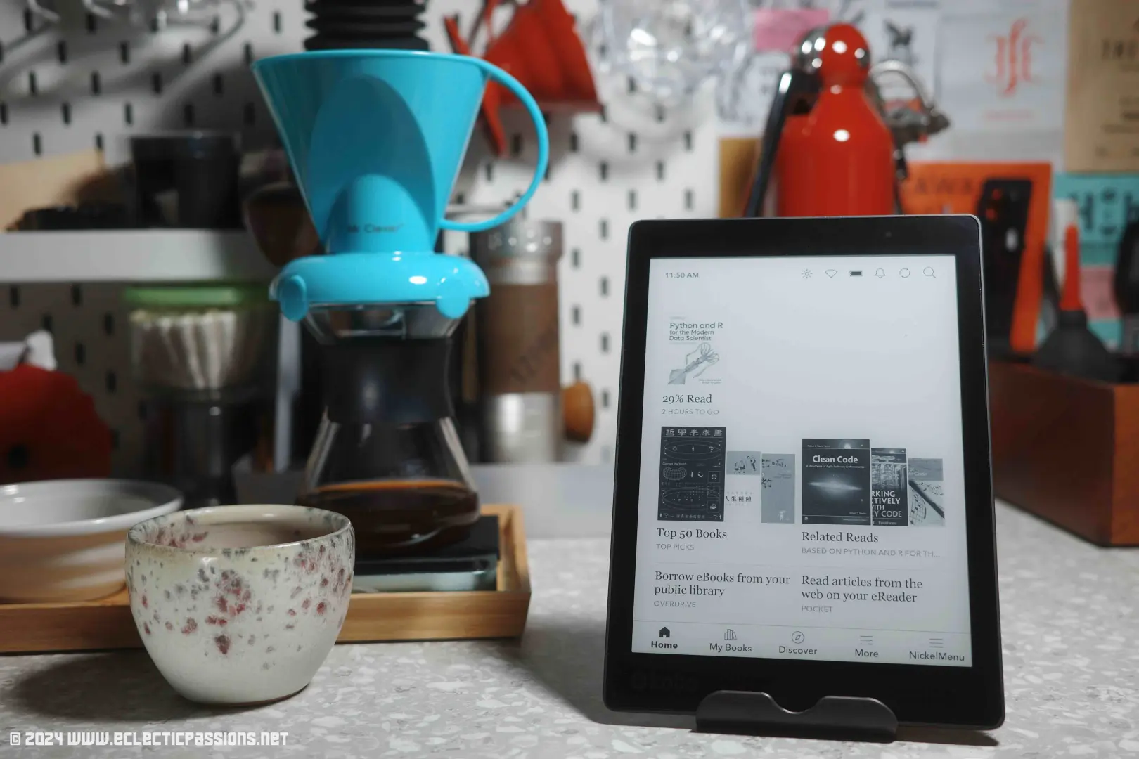 Photo of the Kobo Aura One on my coffee bar